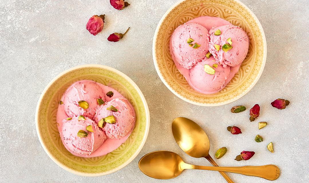 Article Cards Featured Image Strawberry rosewater ice cream , frozen yogurt with pistachio and rosebud. Top view