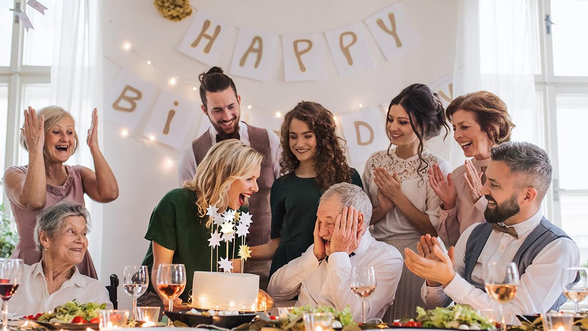 Article Cards Featured Image A senior man with multigeneration family celebrating birthday on indoor party.