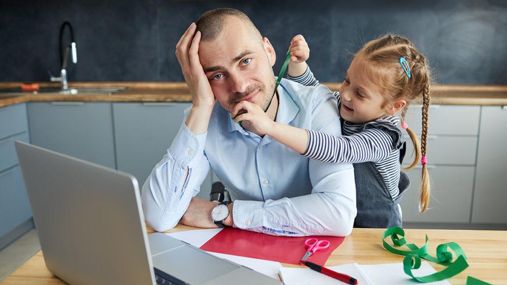 This is an image of daddy brain with a little girl distracting her father while working from home.