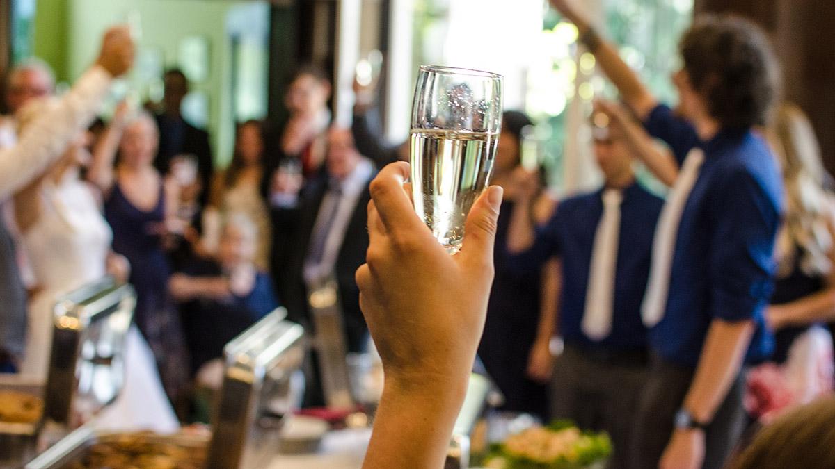 a photo of cremation services with a toast at a restaurant