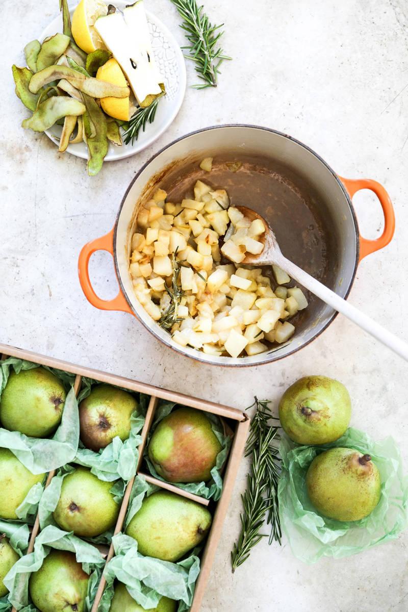 Pot of pear slices being cooked for gin fizz cocktail.