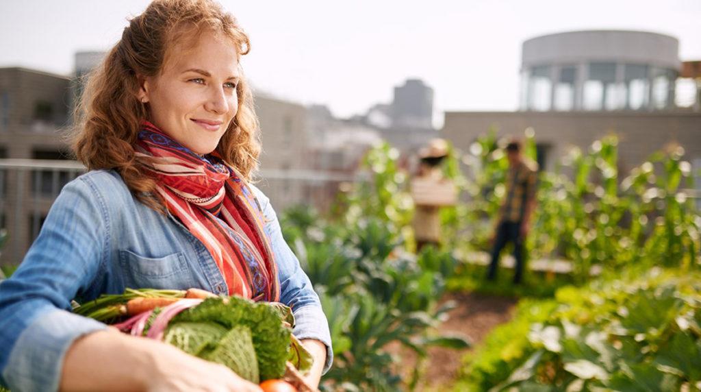 A photo of spring equinox activities woman outside gardening