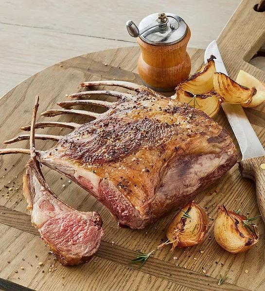 Rack of lamb on a cutting board.